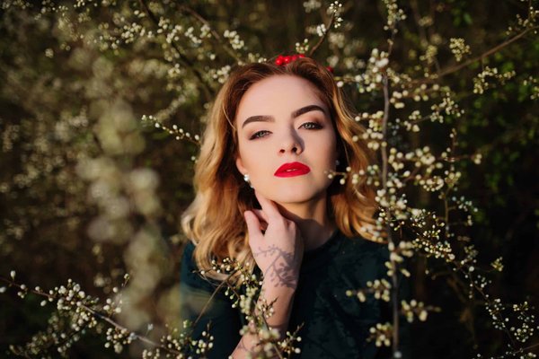 What is the Ideal Way to Wear a Bow Tie Blouse for a Feminine Twist on a Suit Outfit?